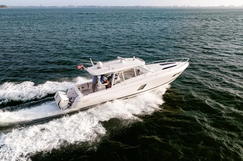  Yacht Photos Pics 2020 Intrepid 407 Cuddy cruising on open water, showcasing sleek design and performance.