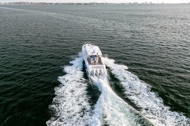  Yacht Photos Pics Aerial view of 2020 Intrepid 407 Cuddy boat cruising on open water.