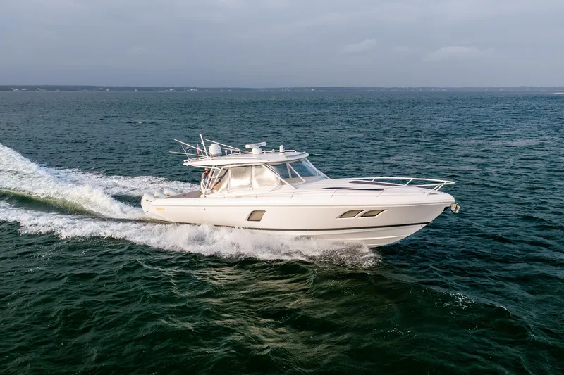  Yacht Photos Pics 2020 Intrepid 407 Cuddy cruising on open water, showcasing sleek design and performance.