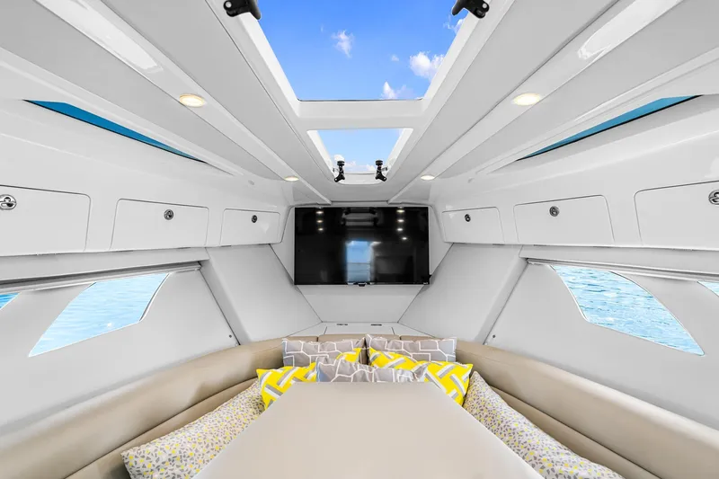  Yacht Photos Pics Luxurious interior of 2020 Intrepid 407 Cuddy boat with skylights and modern design.