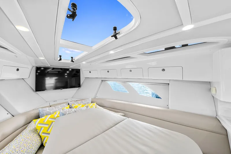  Yacht Photos Pics Luxurious interior of 2020 Intrepid 407 Cuddy boat with skylight and modern amenities.