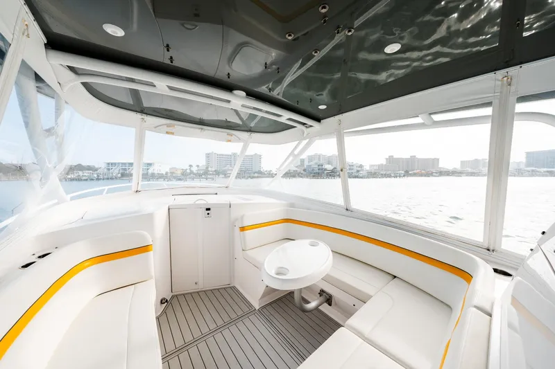  Yacht Photos Pics 2020 Intrepid 407 Cuddy interior with sleek seating and waterfront view.