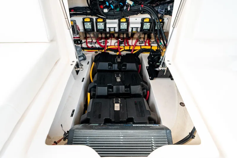  Yacht Photos Pics Battery compartment of 2020 Intrepid 407 Cuddy boat, showcasing wiring and components.