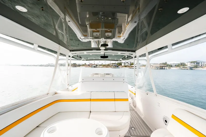  Yacht Photos Pics Interior view of 2020 Intrepid 407 Cuddy boat with white and yellow seating.