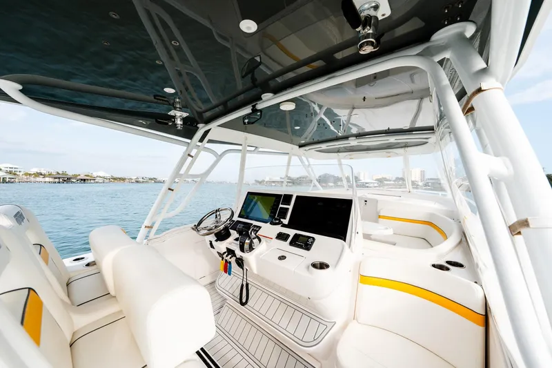  Yacht Photos Pics 2020 Intrepid 407 Cuddy boat interior with modern helm and seating on open water.