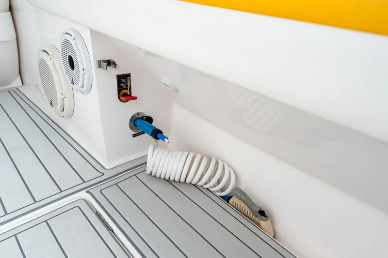  Yacht Photos Pics 2020 Intrepid 407 Cuddy boat deck with coiled hose and speaker system.