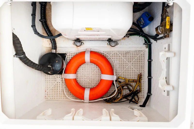  Yacht Photos Pics Storage compartment of 2020 Intrepid 407 Cuddy with life preserver and equipment.