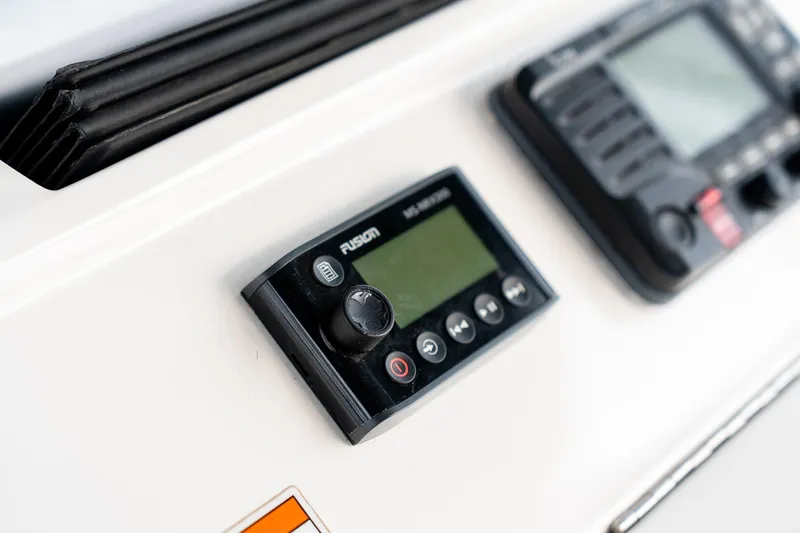  Yacht Photos Pics Close-up of 2020 Intrepid 407 Cuddy boat dashboard with Fusion audio controls.