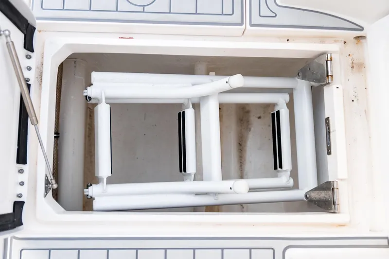  Yacht Photos Pics Foldable ladder in storage compartment of 2020 Intrepid 407 Cuddy boat.