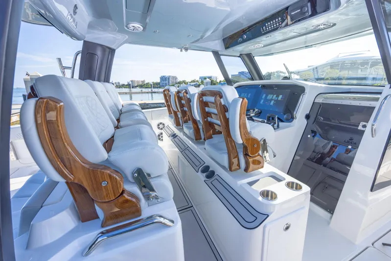  Yacht Photos Pics Interior of 2024 Aquila 47 Molokai boat with luxurious seating and modern dashboard.