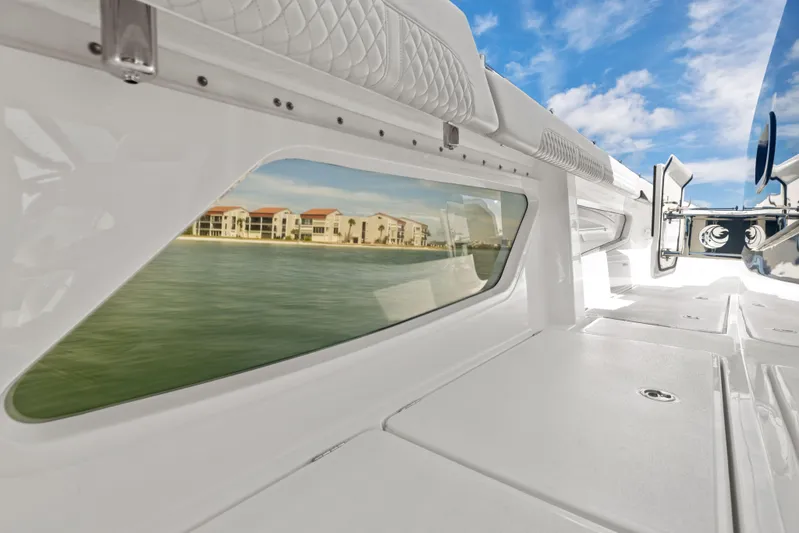  Yacht Photos Pics 2024 Aquila 47 Molokai interior with waterfront view through window.