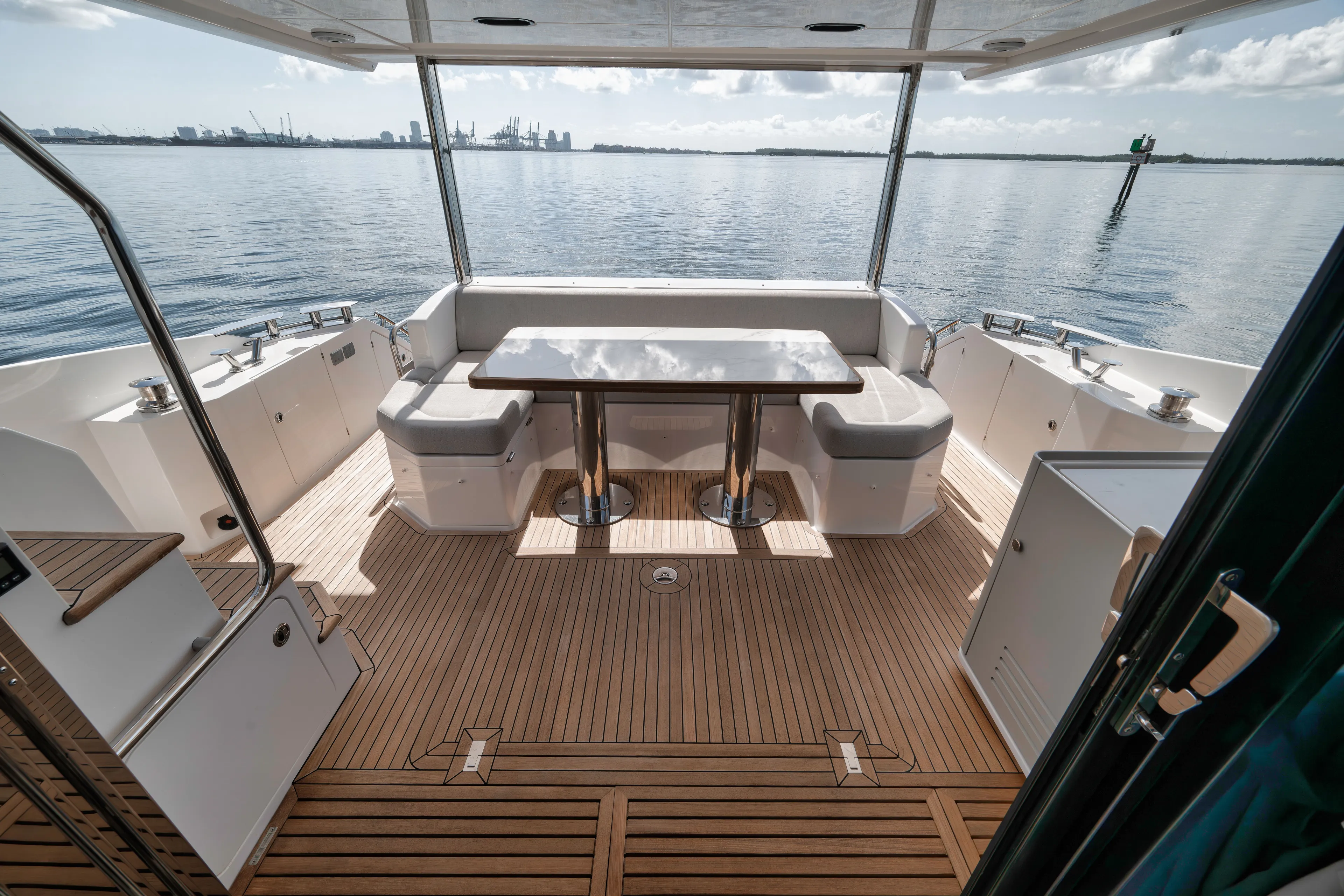  Yacht Photos Pics Azimut Flybridge 2022 yacht with elegant wooden deck and seating area.