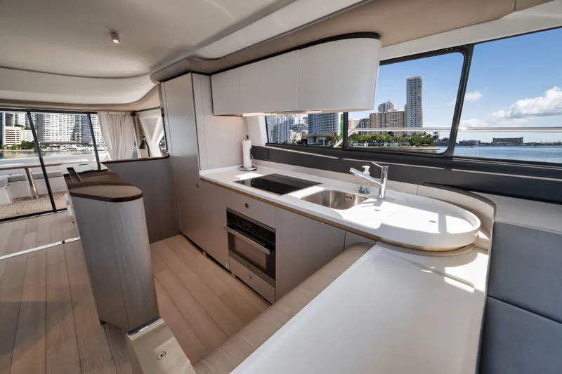  Yacht Photos Pics Interior of 2022 Azimut Flybridge with modern kitchen and city view.