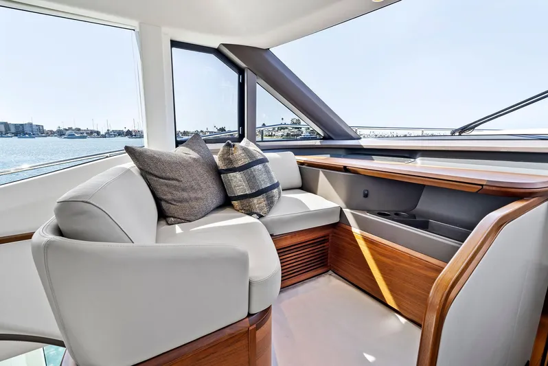 Robri Mar Yacht Photos Pics Luxurious interior of 2023 Princess Y72 yacht with elegant seating and ocean view.