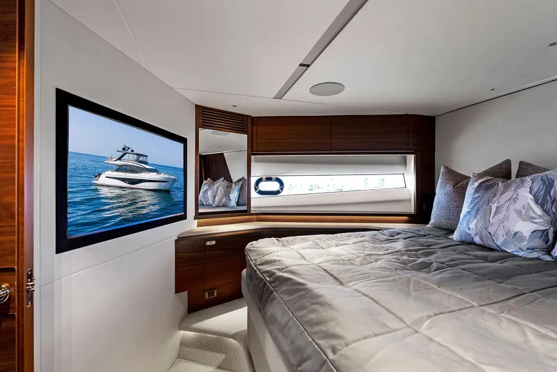 Robri Mar Yacht Photos Pics Luxurious bedroom interior of 2023 Princess Y72 yacht with modern decor and sea view.