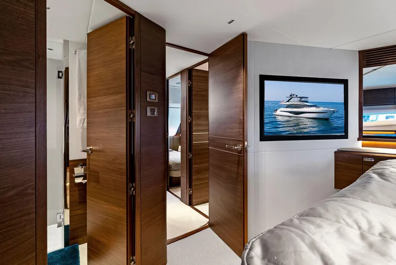 Robri Mar Yacht Photos Pics Luxurious interior of 2023 Princess Y72 yacht with wood paneling and modern decor.