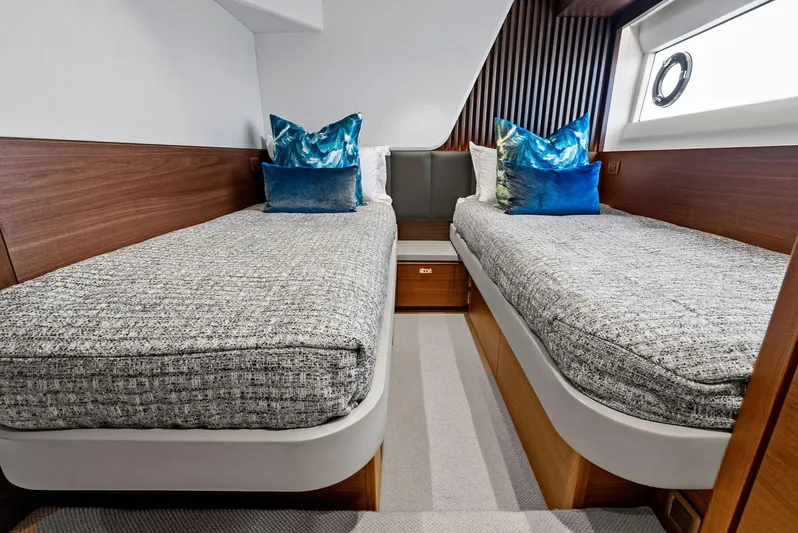 Robri Mar Yacht Photos Pics Luxurious twin cabin in 2023 Princess Y72 yacht with modern decor and plush bedding.