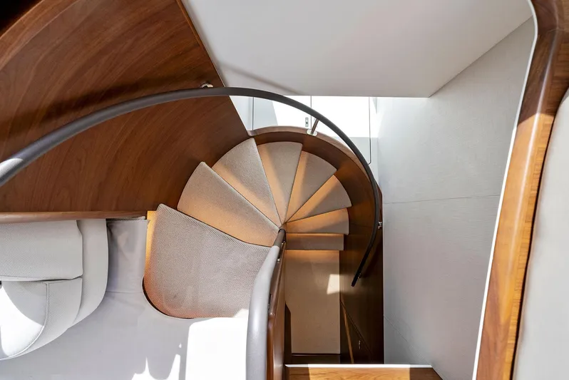 Robri Mar Yacht Photos Pics Elegant spiral staircase in 2023 Princess Y72 yacht interior.