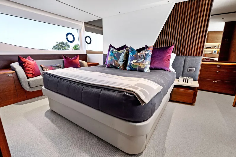 Robri Mar Yacht Photos Pics Luxurious bedroom interior of 2023 Princess Y72 yacht with modern decor and plush bedding.