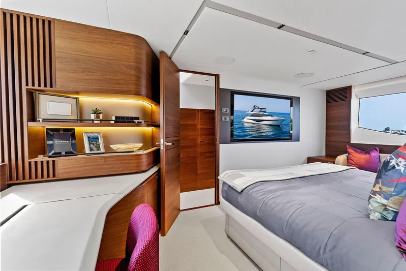 Robri Mar Yacht Photos Pics Luxurious 2023 Princess Y72 yacht bedroom with modern decor and ocean view.