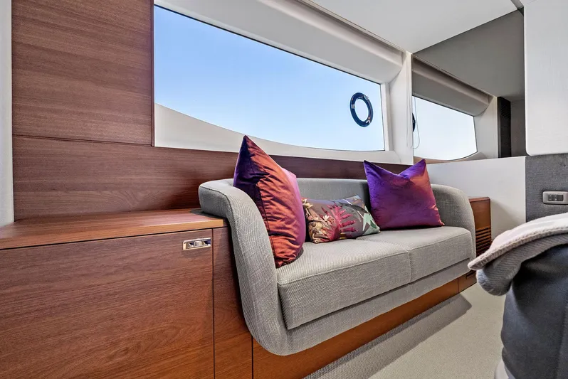 Robri Mar Yacht Photos Pics Luxurious interior of 2023 Princess Y72 yacht with elegant sofa and vibrant cushions.