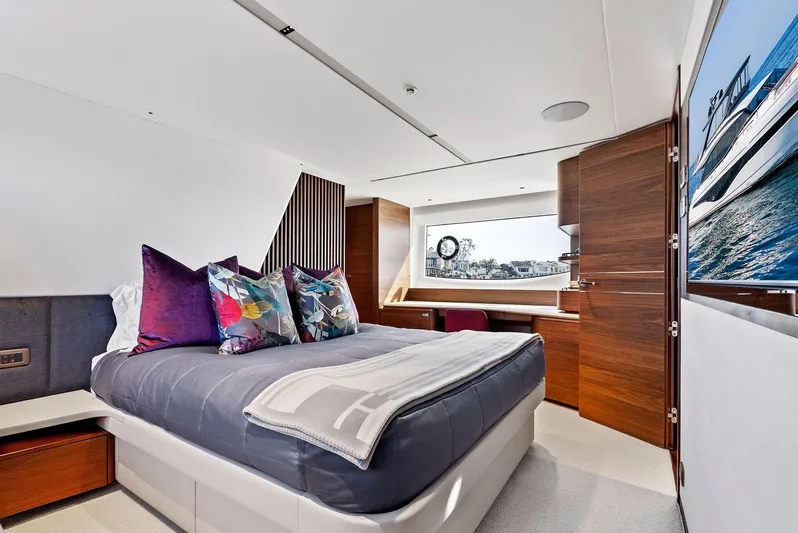 Robri Mar Yacht Photos Pics Luxurious bedroom interior of 2023 Princess Y72 yacht with modern design and scenic window view.