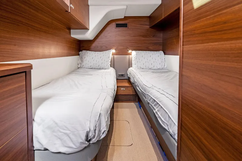 Robri Mar Yacht Photos Pics Luxurious twin cabin interior on 2023 Princess Y72 yacht with wooden finish.