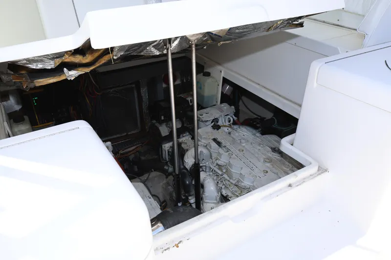 Geranomo Yacht Photos Pics 2007 Luhrs 32 Open engine compartment with visible engine and components.