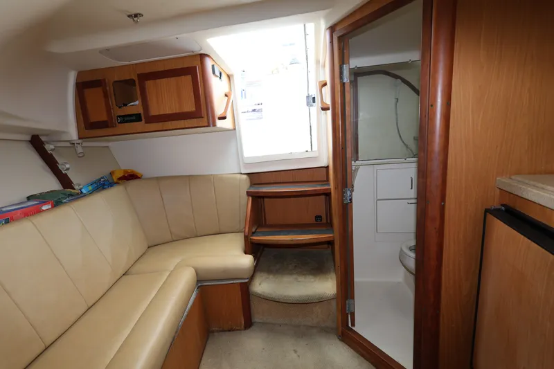 Geranomo Yacht Photos Pics Interior of 2007 Luhrs 32 Open boat with seating area and bathroom.