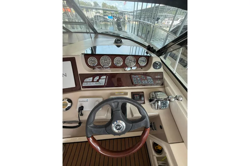  Yacht Photos Pics 2009 Sea Ray 350 Sundancer helm with steering wheel, gauges, and controls.