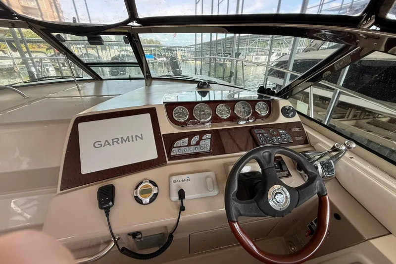  Yacht Photos Pics 2009 Sea Ray 350 Sundancer helm with Garmin navigation system and classic wood finish.