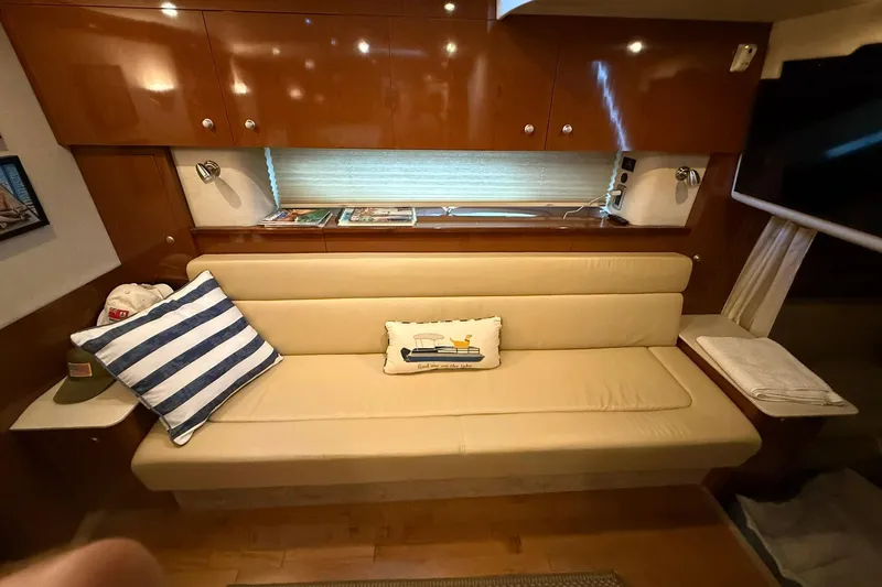  Yacht Photos Pics Interior of 2009 Sea Ray 350 Sundancer with beige seating and nautical decor.
