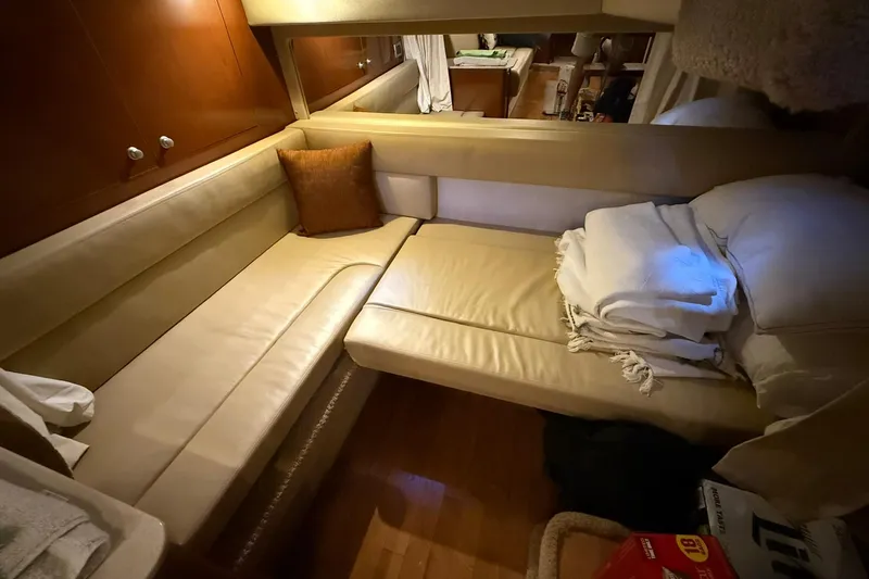  Yacht Photos Pics Interior of 2009 Sea Ray 350 Sundancer with beige seating and cozy cushions.