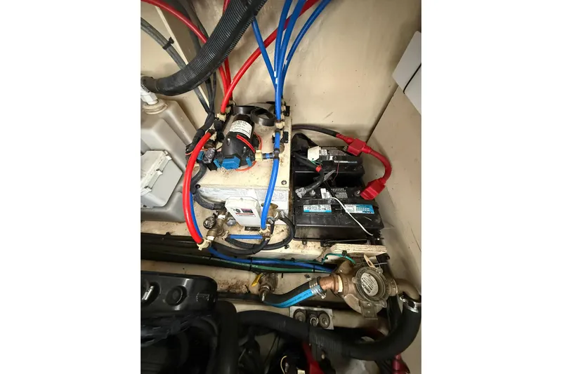  Yacht Photos Pics Engine compartment of a 2009 Sea Ray 350 Sundancer with visible wiring and components.