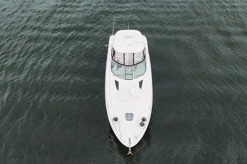  Yacht Photos Pics Aerial view of 2009 Sea Ray Sundancer 350 yacht on calm water.