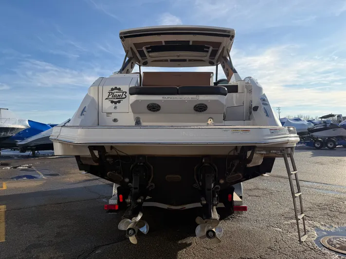  Yacht Photos Pics Rear view of a 2019 Sea Ray 320 Sundancer yacht at the dock.