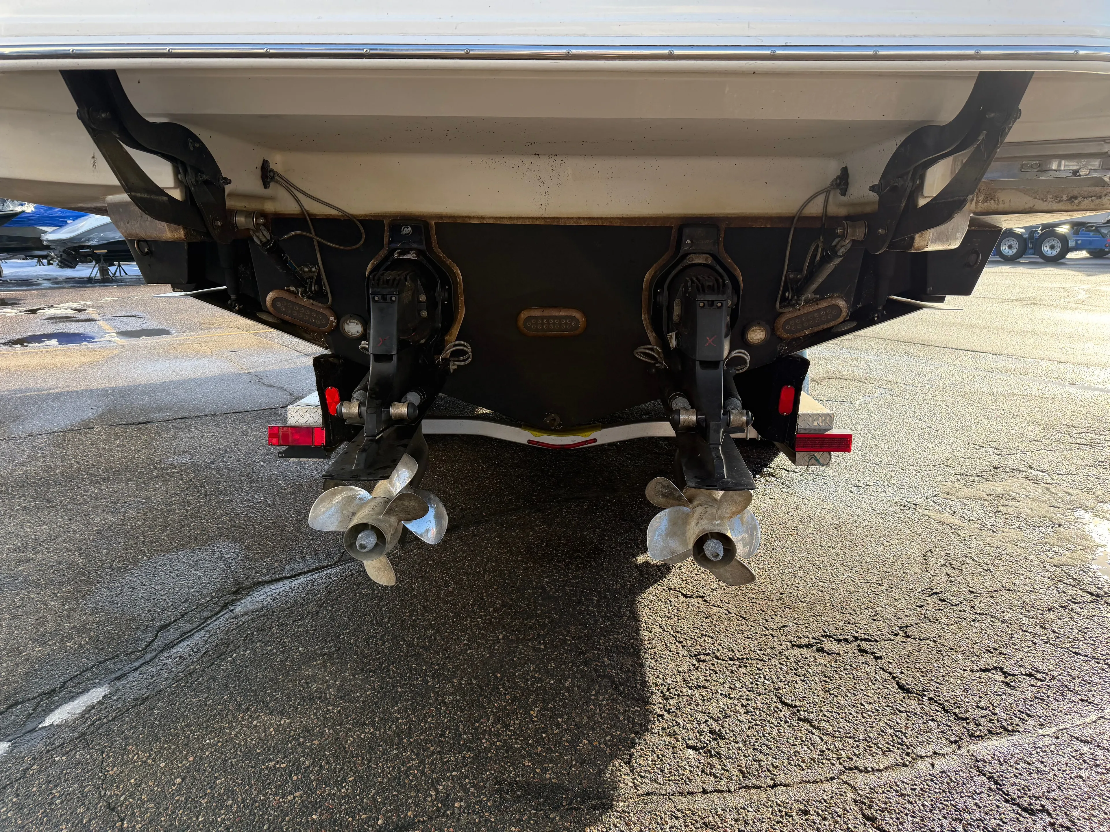  Yacht Photos Pics Rear view of a 2019 Sea Ray 320 Sundancer boat with dual propellers.