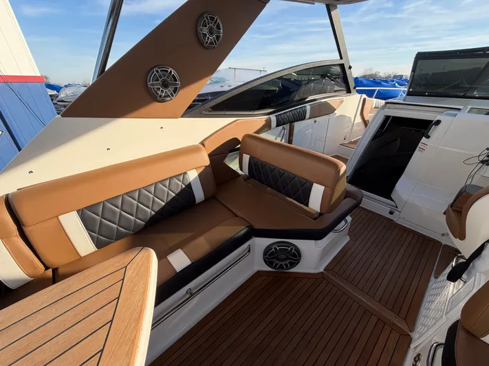  Yacht Photos Pics Interior of a 2019 Sea Ray 320 Sundancer with brown seating.