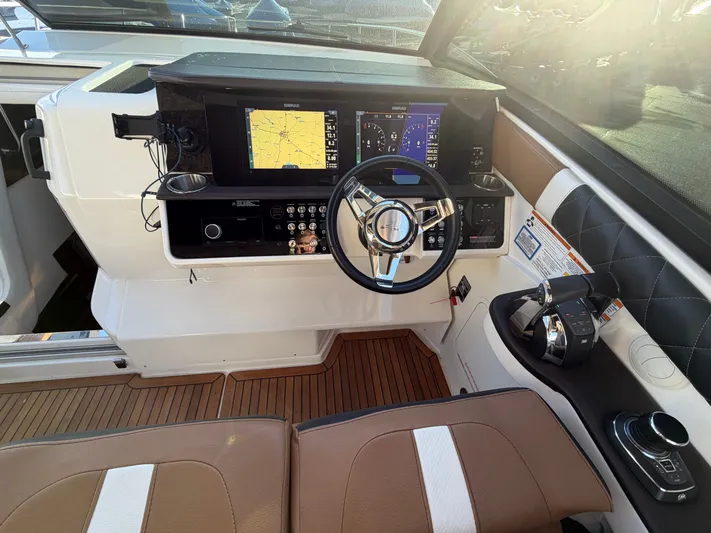  Yacht Photos Pics 2019 Sea Ray 320 Sundancer cockpit with modern navigation system.