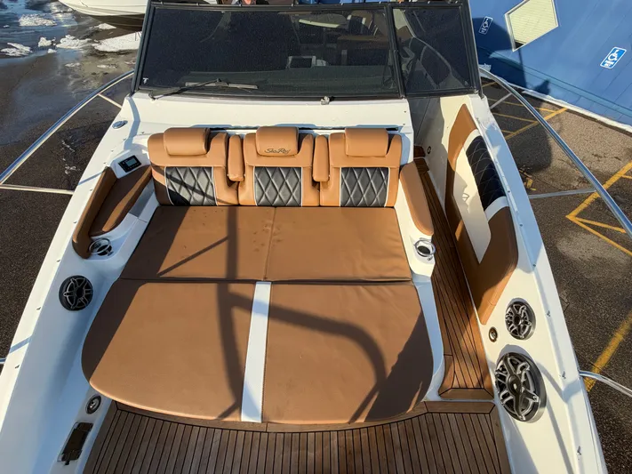  Yacht Photos Pics Interior of a 2019 Sea Ray 320 Sundancer with brown upholstery.