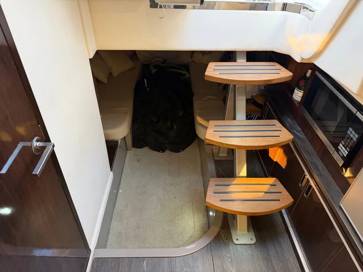  Yacht Photos Pics Interior of 2019 Sea Ray 320 Sundancer boat with wooden steps.