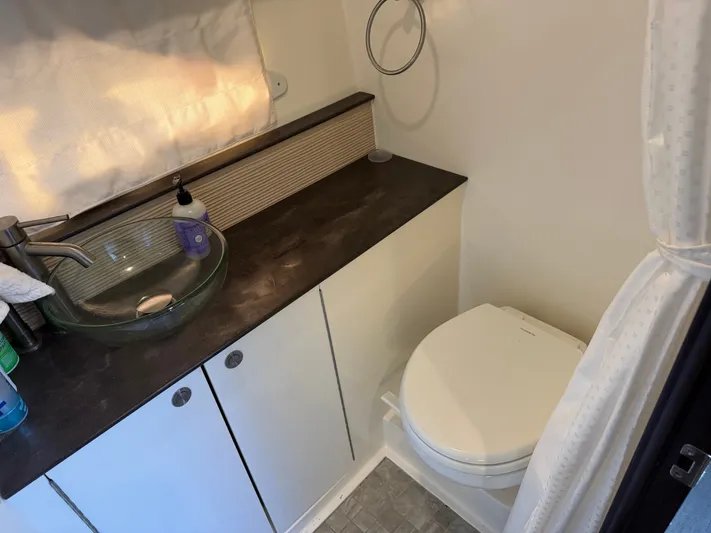  Yacht Photos Pics Sea Ray 320 Sundancer 2019 bathroom with glass sink and toilet.