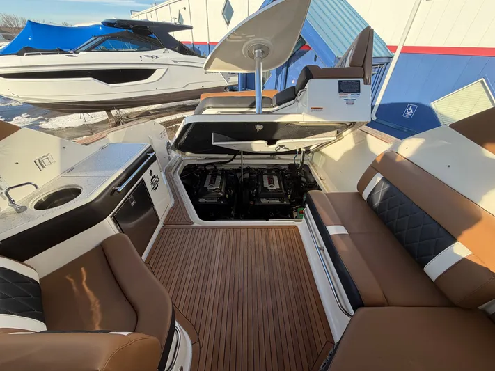  Yacht Photos Pics Interior of a 2019 Sea Ray 320 Sundancer yacht with open engine compartment.