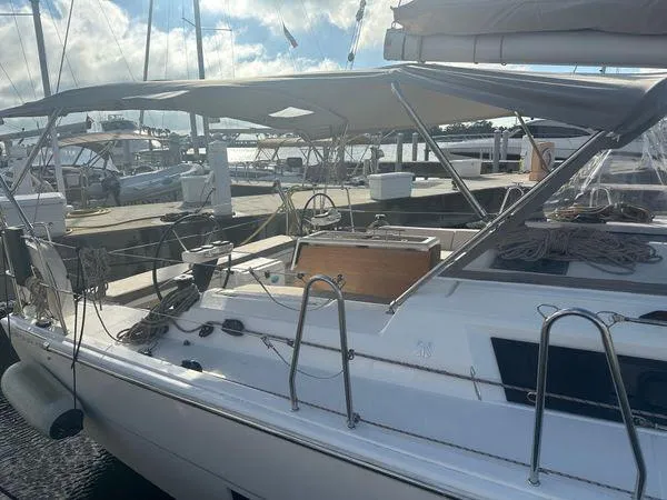 Epiphany Yacht Photos Pics 2022 Dufour 430 sailboat docked at marina under sunny skies.