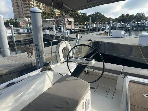 Epiphany Yacht Photos Pics Dufour 430 sailboat cockpit, 2022 model, docked at marina with steering wheel and seating.