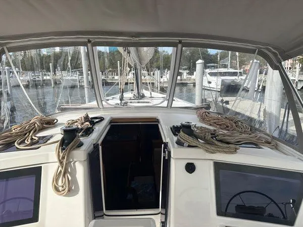 Epiphany Yacht Photos Pics Dufour 430 sailboat cockpit view, 2022 model, docked at marina with ropes and equipment.