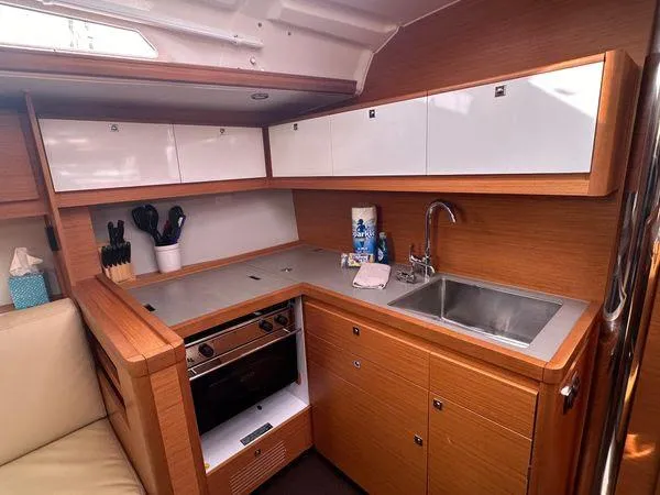 Epiphany Yacht Photos Pics Modern kitchen in 2022 Dufour 430 yacht with wood cabinetry and stainless steel sink.