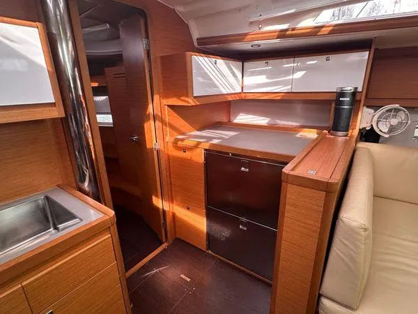 Epiphany Yacht Photos Pics Interior of 2022 Dufour 430 yacht, featuring modern wood cabinetry and sleek design.