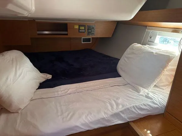 Epiphany Yacht Photos Pics Cozy cabin interior of 2022 Dufour 430 yacht with comfortable bedding.