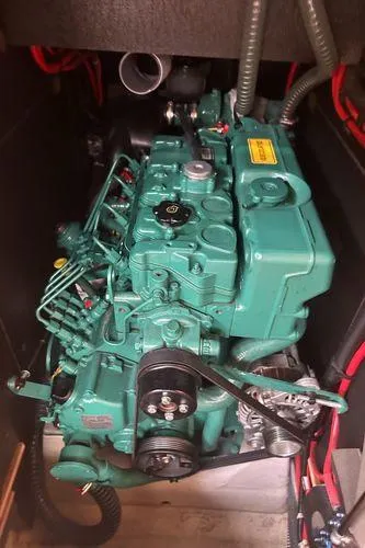 Epiphany Yacht Photos Pics Dufour 430 2022 engine compartment with green marine engine and red wiring.